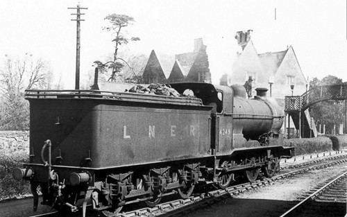 A locomotive steaming through Bourne