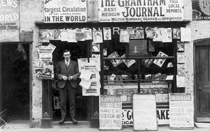 Lorry Warner outside his first shop in 1926