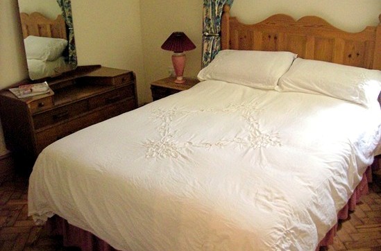 Bedroom with wood block floor